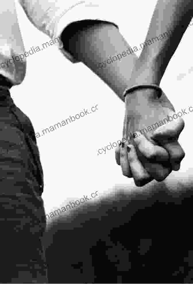 A Couple Holding Hands, Symbolizing The Dynamic Interplay Of Love To Love And Be Loved