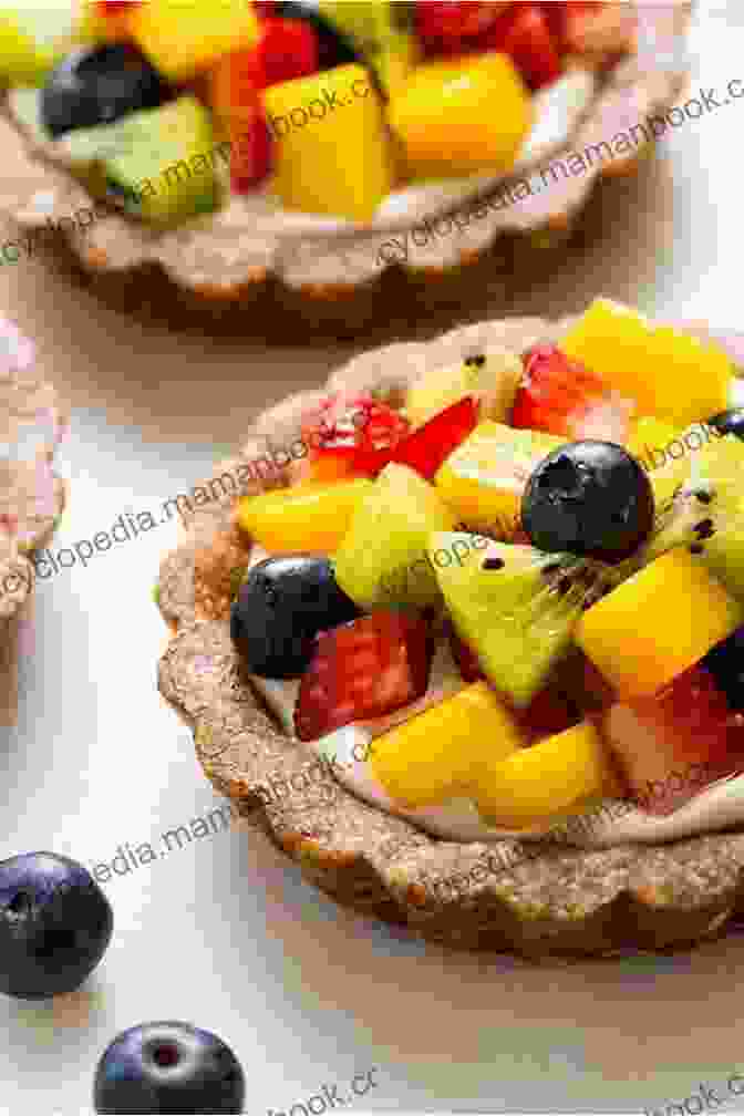 A Decadent Dessert Spread Featuring A Chocolate Cake, A Fruit Tart, And Scoops Of Ice Cream Made From Scratch (Everyday Cookbook Collection)